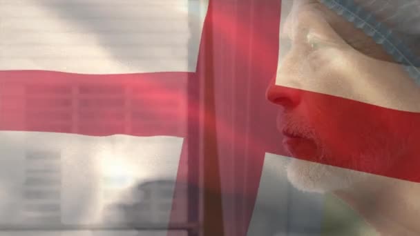 England Flag Waving Caucasian Senior Male Surgeon Looking Out Window — Stok video