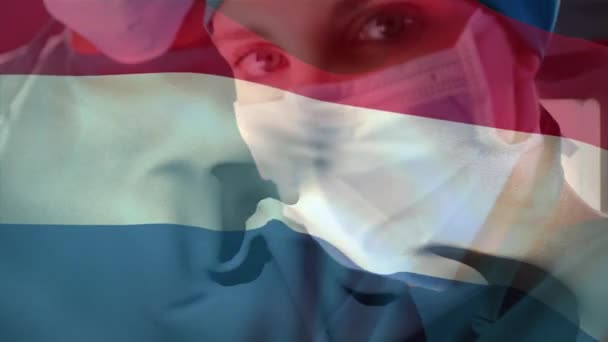 Netherlands Flag Waving Female Senior Surgeon Wearing Face Mask Hospital — Wideo stockowe