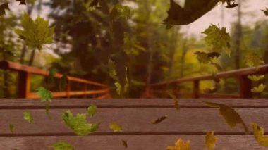 Ormana karşı ahşap yüzeyde yüzen çoklu sonbahar yapraklarının dijital animasyonu. Sonbahar mevsimi konsepti