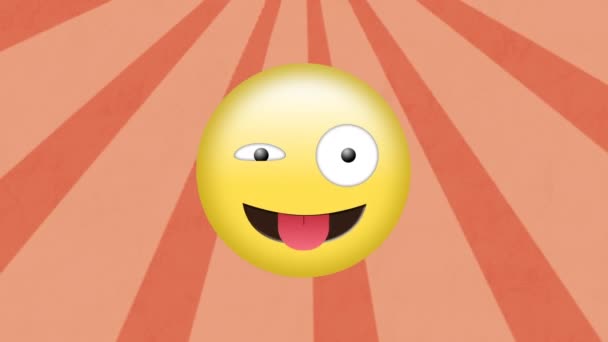 オレンジ色の背景に動く放射状の光線に対する愚かな顔の絵文字のデジタルアニメーション 表現とコミュニケーションの概念 — ストック動画