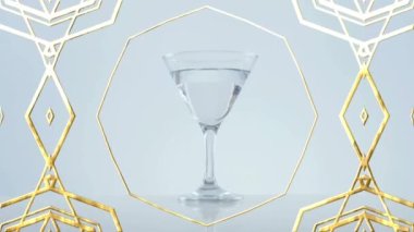 Zeytinlerin üzerindeki altın çerçeve tasarımı gri arka planda kokteyl bardağına düşüyor. gece hayatı ve bar partisi konsepti