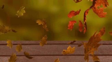 Ormana karşı ahşap yüzeyde yüzen çoklu sonbahar yapraklarının dijital animasyonu. Sonbahar mevsimi konsepti