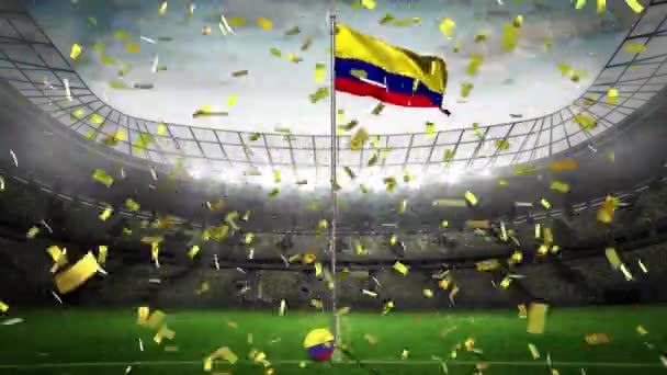 黄金のコンフェッティは 背景にスポーツスタジアムに対してコロンビアの旗を振って転倒しました スポーツ競技とトーナメントのコンセプト — ストック動画
