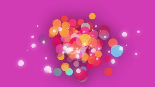 ピンクの背景に浮かぶカラフルなボケの輪のアニメーション 動きエネルギー接続の背景概念デジタルで生成されたビデオ — ストック動画