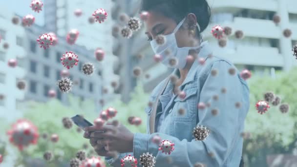 Animation Covid Virus Cells Woman Wearing Face Mask Using Smartphone — Stock Video