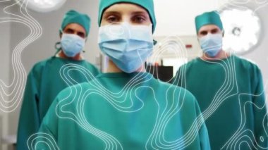 Yüz maskeli cerrahlar üzerinden hareket eden çizgilerin animasyonu. küresel covid 19 salgın hastalık ve sağlık hizmetleri konsepti dijital olarak oluşturulmuş video.