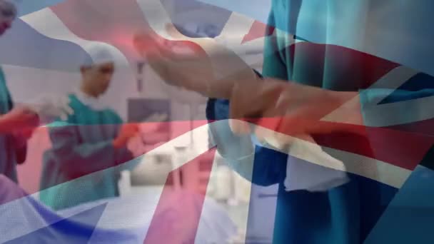 Animação Bandeira Reino Unido Sobre Médicos Durante Cirurgia Conceito Global — Vídeo de Stock