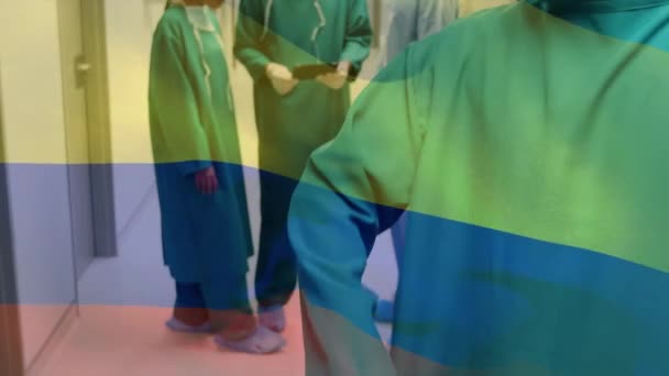 Animation Flag Colombia Waving Surgeons Face Masks Global Covid Pandemic — Stock Video