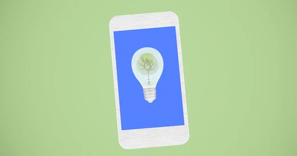 Ampuldeki Ağaç Kompozisyonu Mavi Akıllı Telefon Ekranında Yeşil Arka Planda — Stok fotoğraf