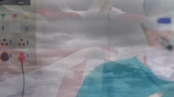 Animatie Van Britse Vlag Artsen Tijdens Operatie Mondiaal Concept Voor — Stockvideo