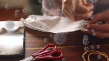 Yüz maskesi dikilen kişi üzerinde covid 19 hücrenin animasyonu. küresel covid 19 salgın, ilaç ve sağlık hizmetleri konsepti dijital olarak oluşturulmuş video.