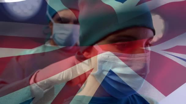 Animatie Van Britse Vlag Artsen Tijdens Operatie Mondiaal Concept Voor — Stockvideo
