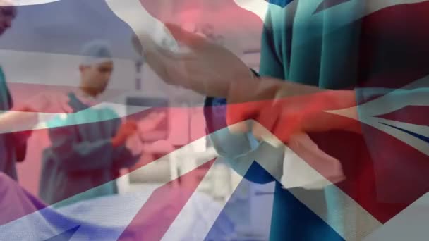 Animation Drapeau Britannique Sur Les Médecins Pendant Chirurgie Concept Mondial — Video