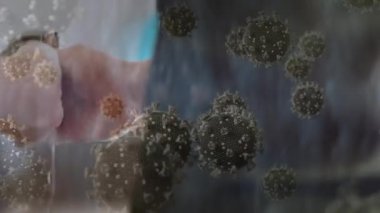 El yıkayan kişinin üzerinde kovid 19 hücrenin animasyonu. küresel covid 19 salgın, ilaç ve sağlık hizmetleri konsepti dijital olarak oluşturulmuş video.