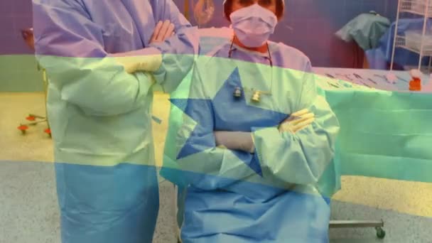 Animação Bandeira Ghana Acenando Sobre Cirurgiões Máscaras Faciais Conceito Global — Vídeo de Stock