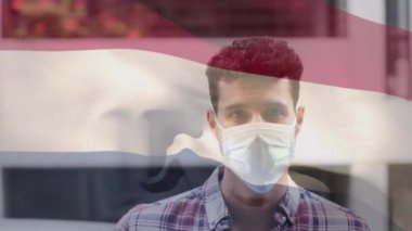 Lükenburg bayrağının maskeli bir adamın üzerinde dalgalanmasının animasyonu. küresel covid 19 salgın hastalık ve sağlık hizmetleri konsepti dijital olarak oluşturulmuş video.