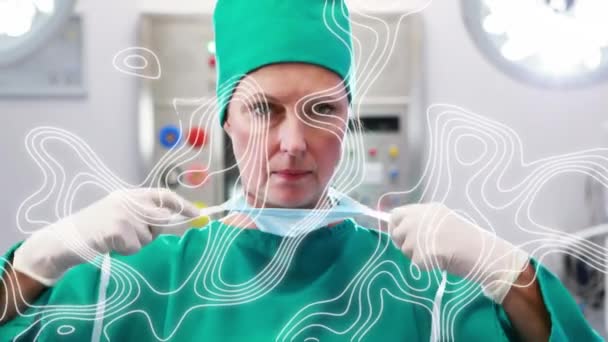 头戴口罩的外科医生上方移动线条的动画 全球联盟19大流行病和保健服务概念数字制作视频 — 图库视频影像