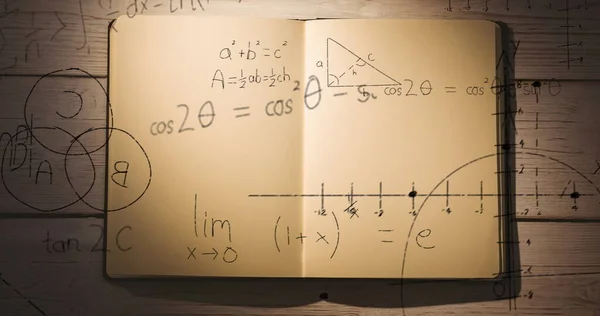 Digitální Složený Obraz Matematických Rovnic Diagramů Pohybujících Nad Otevřeným Notebookem — Stock fotografie