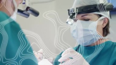 Yüz maskeli cerrahlar üzerinden hareket eden çizgilerin animasyonu. küresel covid 19 salgın hastalık ve sağlık hizmetleri konsepti dijital olarak oluşturulmuş video.