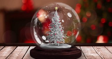 Kar küresindeki parlak peri ışıklarıyla ve ahşap yüzeyde kayan yıldızlı noel ağacı. Noel kutlaması konsepti dijital olarak oluşturulmuş görüntü.