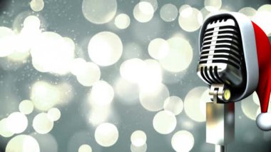 Parlayan Bokeh 'in üzerinde Noel Baba şapkası olan yeniden mikrofon animasyonu. Noel, gelenek ve kutlama konsepti dijital olarak oluşturuldu.