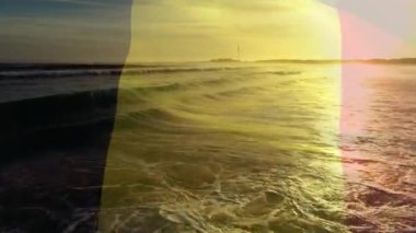 Sahilde dalgalanan Belçika bayrağının animasyonu. seyahat, tatiller, vatanseverlik ve dijital olarak üretilen video konsepti.