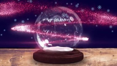 Tahta tahtalardaki kar küresindeki Noel kutlamaları, kayan yıldızlar ve düşen karların animasyonu. Noel, kış, gelenek ve kutlama konsepti dijital olarak oluşturulmuş video.