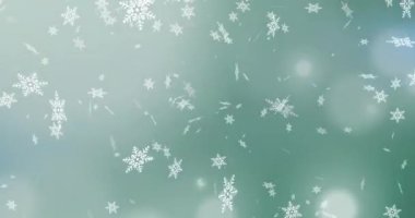 Yeşil arka plandaki ışık noktalarına düşen kar tanelerinin dijital animasyonu. Noel şenliği ve kutlama konsepti