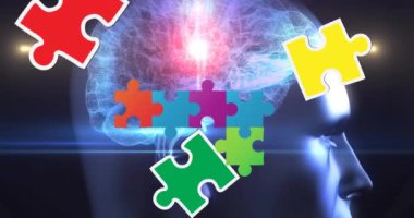 İnsan kafasının üzerindeki renkli yapboz parçalarının canlandırılması. otizm, öğrenme güçlüğü, destek ve farkındalık kavramı dijital olarak oluşturulmuş video.