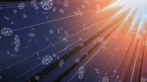 Animering Snö Faller Över Glödande Orange Strålar Grå Bakgrund Jul — Stockvideo
