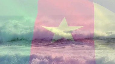 Deniz manzarasında dalgalanan kamerun bayrağının animasyonu. seyahat, tatiller, vatanseverlik ve dijital olarak üretilen video konsepti.