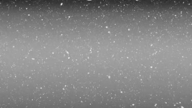 Mutlu noel mesajlarının üzerine kar yağıyor ve gri arka plana süslemeler asılıyor. Noel şenliği ve kutlama konsepti