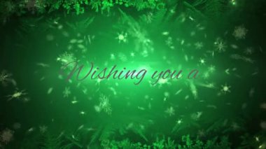 Kar taneleri ve yeşil arka planda ışık lekeleri üzerine mutlu bayramlar. Noel şenliği ve kutlama konsepti