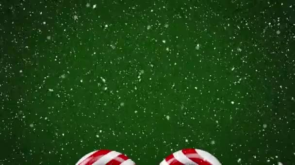 Animation Snow Falling Christmas Candies Green Background Christmas Tradition Celebration — Stock Video