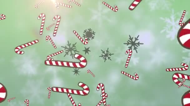 雪の結晶と緑の背景に光のスポットに対して落ちる複数のキャンディーの杖のアイコン クリスマス フェスティバルとお祝いのコンセプト — ストック動画