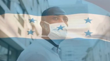 Covid 19 salgını sırasında yüz maskesi takan adamın üzerinde sallanan Honduras bayrağı animasyonu. küresel covid 19 salgın konsepti dijital olarak oluşturulmuş video.