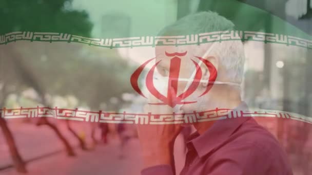 Animación Bandera Irán Ondeando Sobre Hombre Con Máscara Facial Durante — Vídeo de stock
