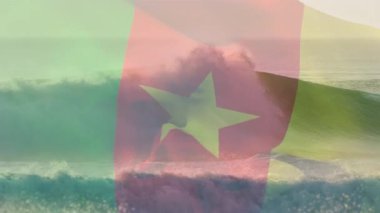Sahilde dalgalanan kamerun bayrağının animasyonu. seyahat, tatiller, vatanseverlik ve dijital olarak üretilen video konsepti.