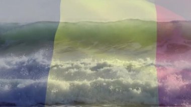 Sahilde dalgalanan Belçika bayrağının animasyonu. seyahat, tatiller, vatanseverlik ve dijital olarak üretilen video konsepti.