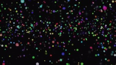 Siyah arkaplan üzerinde çok renkli parlak noktaların canlandırması. Noel, kış, gelenek ve kutlama konsepti dijital olarak oluşturulmuş video.