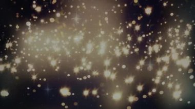 Konfeti animasyonu ve siyah arka planda parlayan sarı noktalar. Noel, kış, gelenek ve kutlama konsepti dijital olarak oluşturulmuş video.