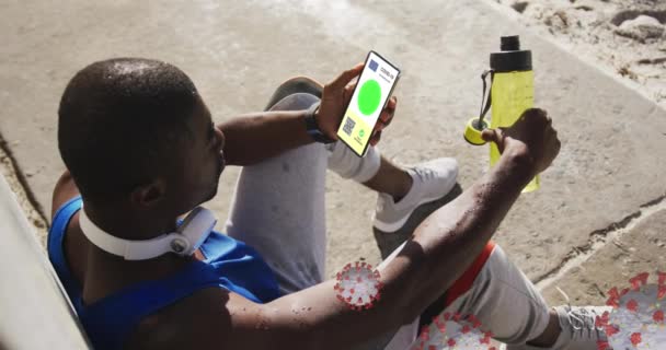 Animation Man Holding Smartphone Covid Vaccination Passport Coronavirus Cells Global — Stock Video