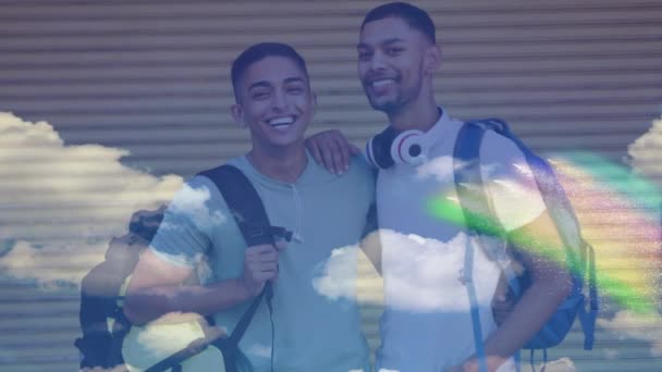 Animation Rainbow Clouds Smiling Gay Male Couple Backpacks Embracing Lgbtq — Stock Video