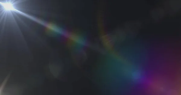 Image of glowing yellow spots of light lens flare moving in hypnotic motion in seamless loop on grey background. Light colour and movement concept digitally generated image.