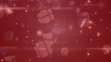 Yıldızların animasyonu, Noel hediyeleri, kırmızı filtreli bokeh arkaplanının üzerine düşen toplar ve kar. Noel, kış, gelenek ve kutlama konsepti dijital olarak oluşturulmuş video.