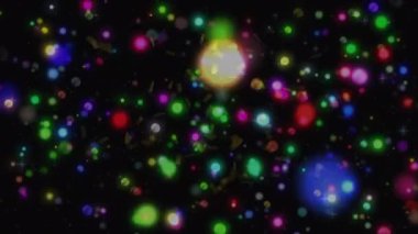 Konfeti animasyonu ve siyah arka planda çok renkli lekeler. Noel, kış, gelenek ve kutlama konsepti dijital olarak oluşturulmuş video.