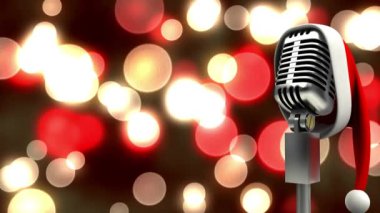 Noel Baba şapkası mikrofonda, kırmızı ve sarı noktalara karşı siyah arka plan. Noel müziği ve kutlama konsepti