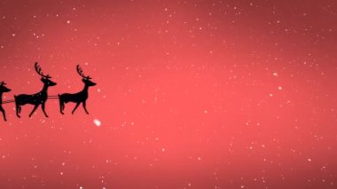 Noel Baba 'nın siluetinin üzerine düşen kar, turuncu arka planda ren geyikleri tarafından çekiliyor. Noel şenliği ve kutlama konsepti