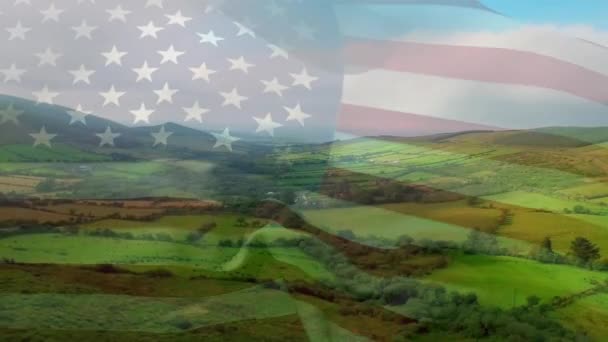 緑の風景の上に吹くウサの旗のアニメーション 愛国心とお祝いの概念デジタルで生成されたビデオ — ストック動画