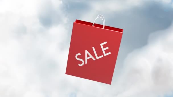 青い空に雲に対して浮かんでいる赤いショッピングバッグアイコンにテキストを販売します 販売割引や小売業のコンセプト — ストック動画